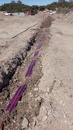 Trench with red tape